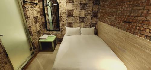 Postel nebo postele na pokoji v ubytování 慶爾喜旅館長沙館Cheers Loft Self Check-in Hotel