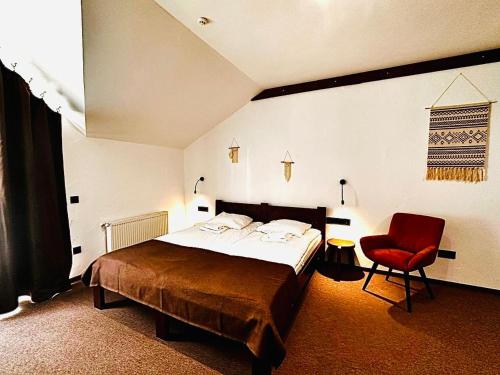 Кровать или кровати в номере ZimaSnow Ski & Spa Club