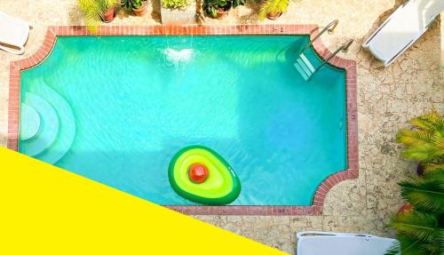 an overhead view of a swimming pool with a pool noodle at Bposhtels San Juan in San Juan