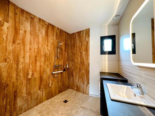 a bathroom with a sink and a mirror at Gites-domainedupin, cottage "Mosnes à Lisa" in Mosnes