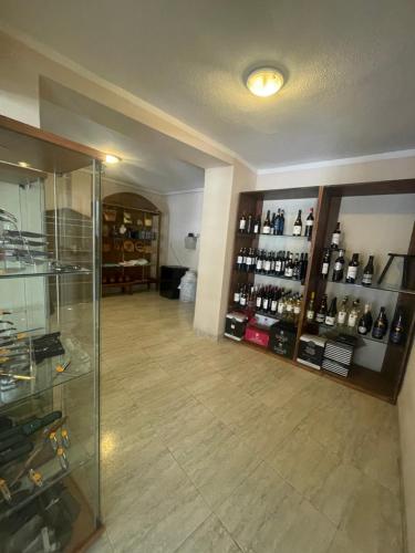 a room with a room with bottles of wine at Hotel Restaurante Felipe II in Ayna