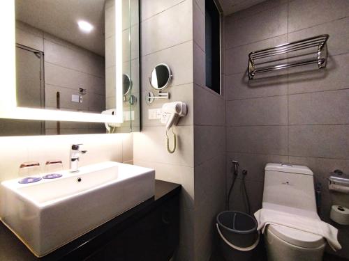 a bathroom with a sink and a toilet at TopGenting SkyForestColdSty2R1B7Pax @GrdIonDelmn in Genting Highlands