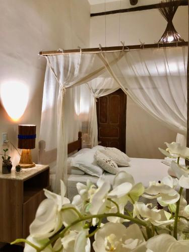 Eliza, Bangalô vista mar em Trancosoにあるベッド