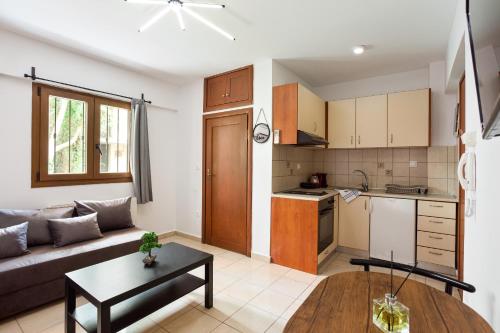 a living room with a couch and a table at Anopolh apartment 11 in Thessaloniki