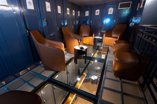 an overhead view of a waiting room with chairs and a table at Best Western Premier Le Chapitre Hotel and Spa in Remiremont