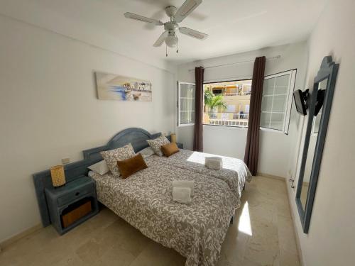 a bedroom with a bed and a ceiling fan at Los Mangueros Beach 6 in Puerto de Mogán