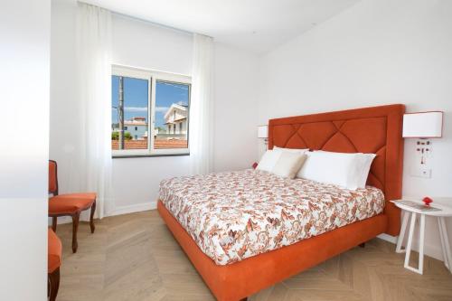 Postel nebo postele na pokoji v ubytování Villa Flavia