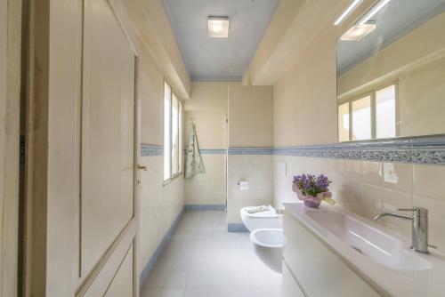 a bathroom with a toilet and a sink and a tub at I Bei Ricordi - Historic Centre Apartment 6 in Arezzo