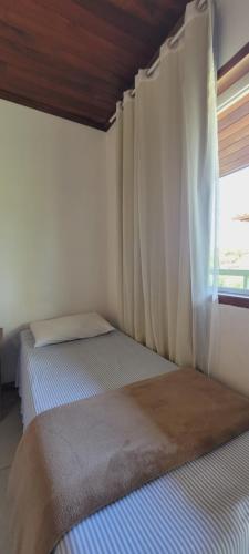 Postel nebo postele na pokoji v ubytování Pousada Paraty Graziela