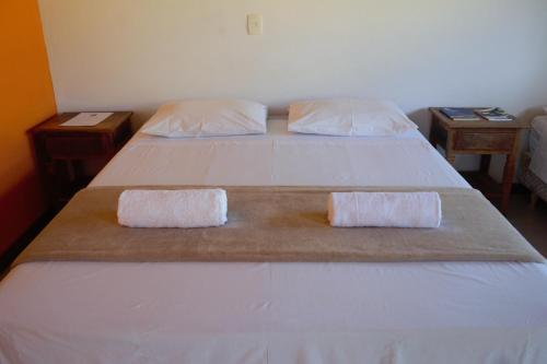 מיטה או מיטות בחדר ב-Pousada Paraty Graziela