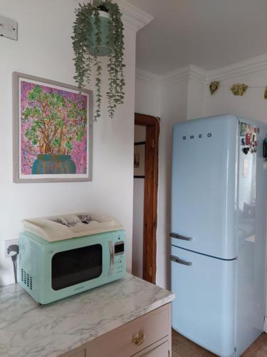 Η κουζίνα ή μικρή κουζίνα στο Portobello Charming Seaside 3-BR Holiday Apartment