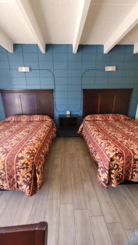 Postel nebo postele na pokoji v ubytování Relax Inn
