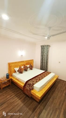 a bedroom with a large bed in a room at Moonshine Homestay Kashmir in Srinagar