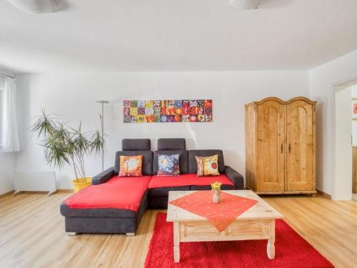a living room with a couch and a table at Elegant Appartment in Freiburg im Breisgau