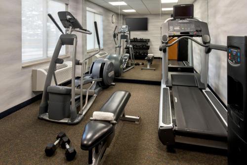 a gym with cardio equipment and tread machines at Fairfield Inn by Marriott New York LaGuardia Airport/Flushing in Queens