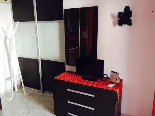 A television and/or entertainment centre at Atene Apartment