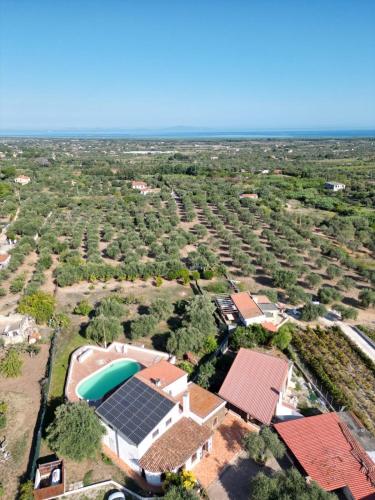 an aerial view of a house with solar panels on it at Villa Maddalena guest house in Sorso