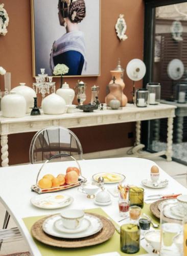 a white table with plates of food on it at La Maison Ruffinoise in Sainte-Ruffine