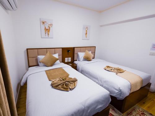 Ένα ή περισσότερα κρεβάτια σε δωμάτιο στο Gleem Luxury Apartments Elite