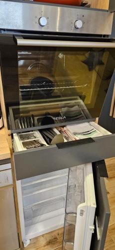 an open refrigerator with its door open at Lana Lux Milmari Resort in Kopaonik