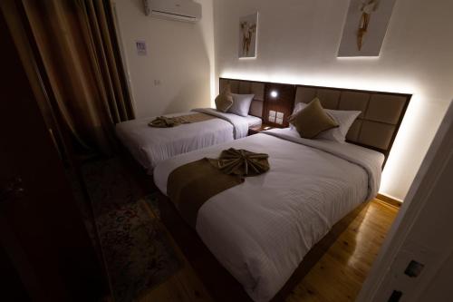 Ένα ή περισσότερα κρεβάτια σε δωμάτιο στο Gleem Luxury Apartments Elite