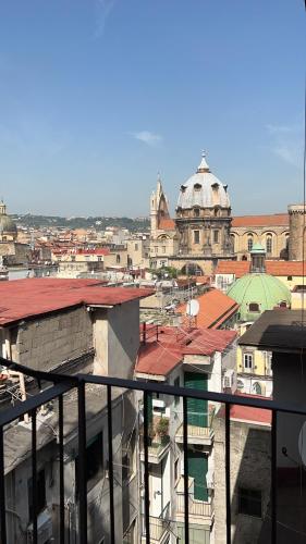 a view of a city from the balcony of a building at Medusa Duomo Guest House in Naples