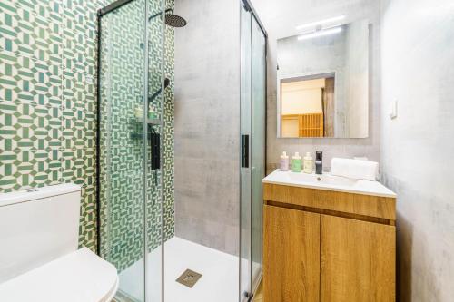 a bathroom with a shower and a toilet and a sink at Atlantic Bliss in Albufeira