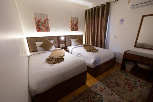 Ένα ή περισσότερα κρεβάτια σε δωμάτιο στο Gleem Luxury Apartments Elite