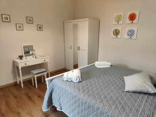 a bedroom with a bed and a desk with a computer at Alloggio Turistico C'era una volta in Roccalvecce