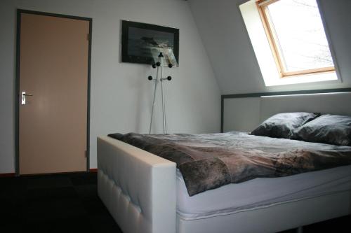 En eller flere senger på et rom på Appartement De Molshoop