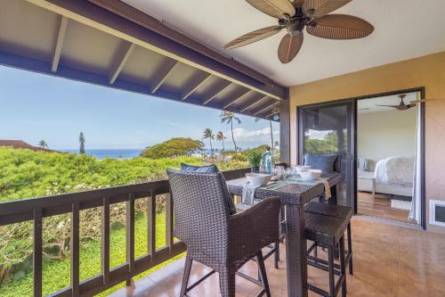 a balcony with a table and chairs and the ocean at Kaanapali Plantation 58 in Lahaina