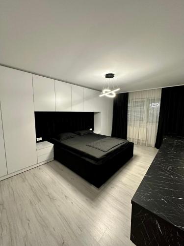 Llit o llits en una habitació de Apartament 2 Dormitoare