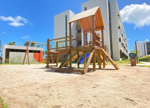 a playground in front of a building at Mana Beach Experience in Ipojuca