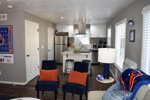a kitchen with blue chairs and a kitchen table at Bsu Playland 3bd 1b Fully Remodeled on Bsu Campus in Boise