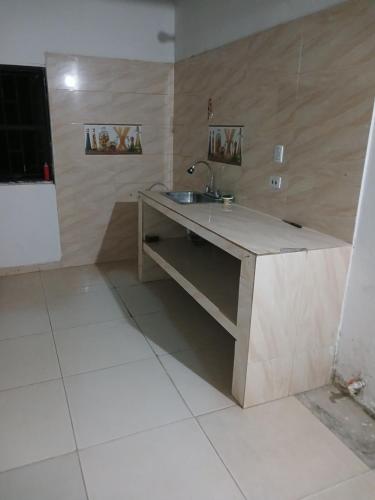 a kitchen with a sink and a counter at Casa camacho in Villavicencio