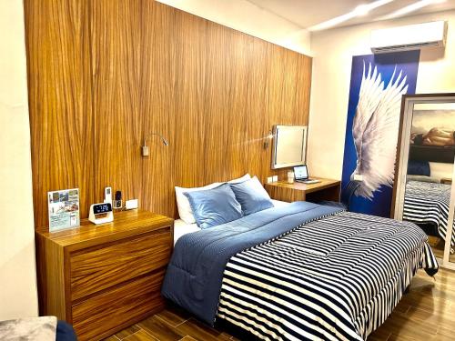 Postel nebo postele na pokoji v ubytování Sky Inn Hotel - Cancun