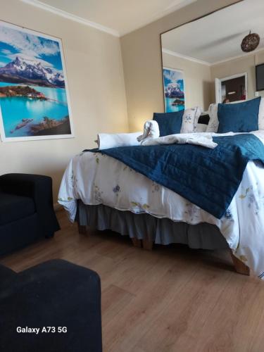 Postel nebo postele na pokoji v ubytování Hostal Chile Chico