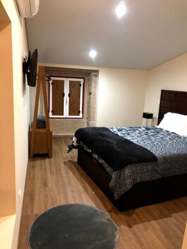 Säng eller sängar i ett rum på Casas do Solar - Guest House -