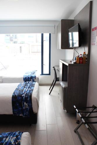 Cama o camas de una habitación en Agora Suites Self-Service Boutique Hotel