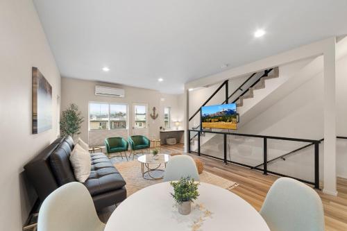 a living room with a couch and a tv at Brand New Fully Updated Condo 912 in Anacortes in Anacortes