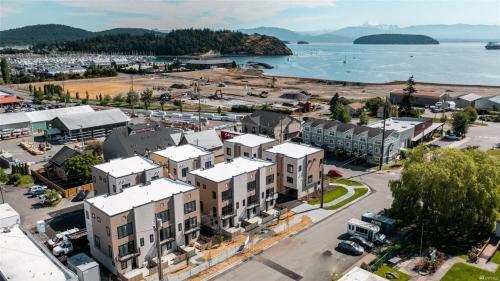 an aerial view of a town next to a body of water at Brand New Fully Updated Condo 912 in Anacortes in Anacortes