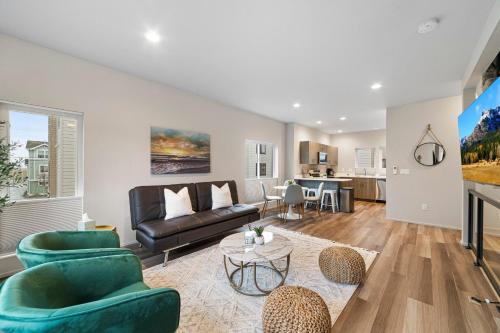 a living room with a couch and a table at BRAND NEW Fully Updated Condo 918 in Anacortes in Anacortes