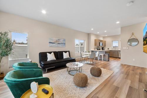 a living room with a couch and a table at BRAND NEW Fully Updated Condo 918 in Anacortes in Anacortes
