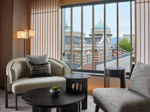 a living room with a view of a building at Dusit Thani Kyoto in Kyoto