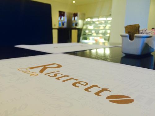 a sign with the word pharmacy on a table at Tulip Hotel & Suites in Manama