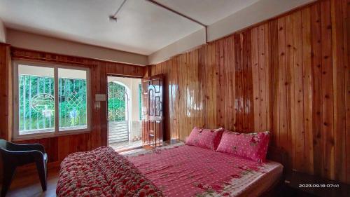 Postel nebo postele na pokoji v ubytování Tigerhill Homestay