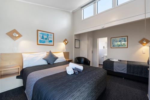 Postelja oz. postelje v sobi nastanitve Central Inn Taupo