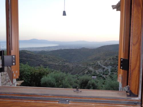 an open window with a view of a valley at Menina Farm Kalamata Countryside in Perivolákia