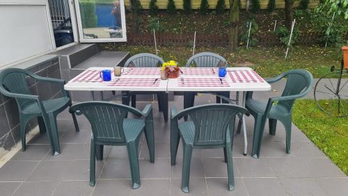 a table and chairs sitting on a patio at Apartament Park Śląski in Katowice
