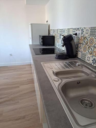 Dapur atau dapur kecil di BudgetBnb petit duplex centre médiéval